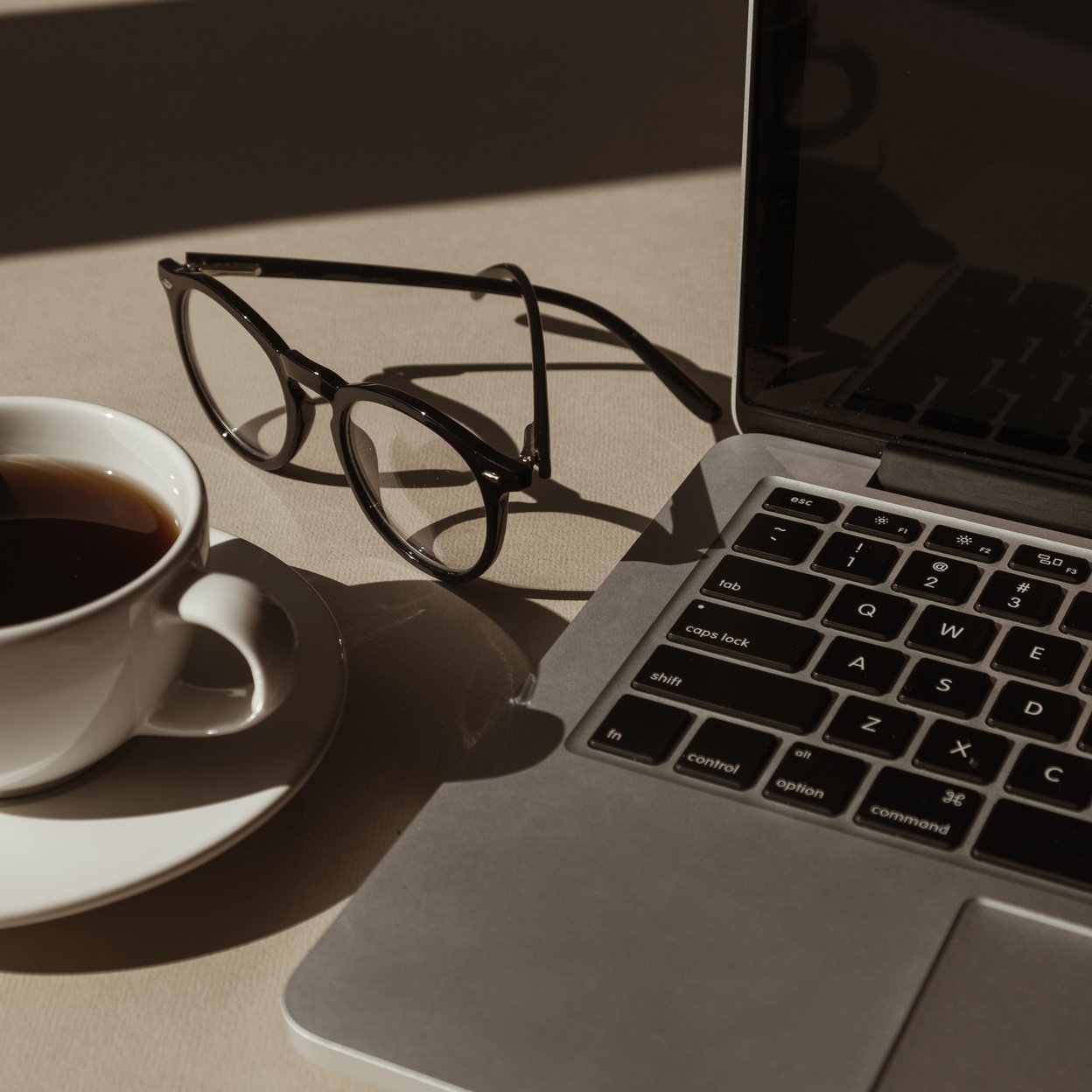 Workspace with Coffee and Eyeglasses